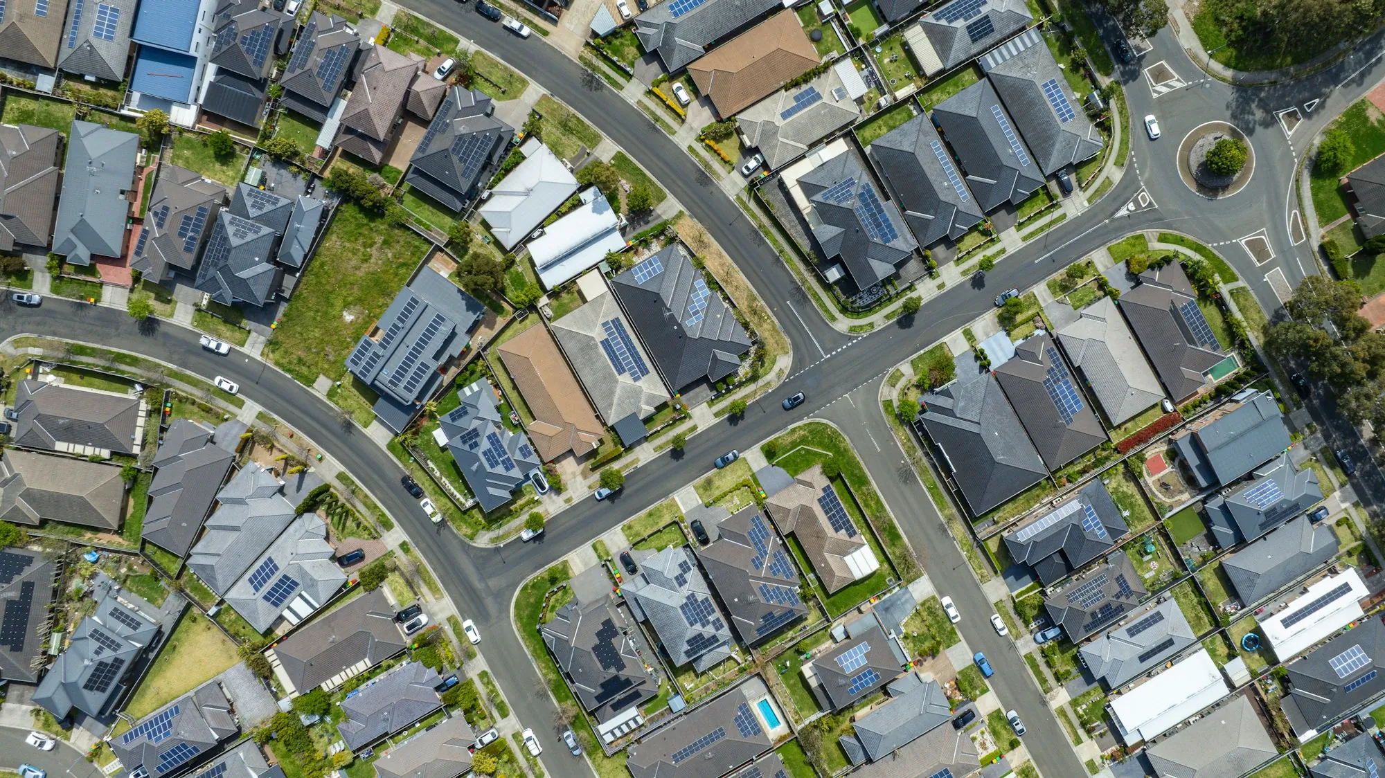 Aerial view of a planned suburban subdivision with curving streets